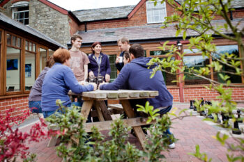 Drinking coffee outside the Stables